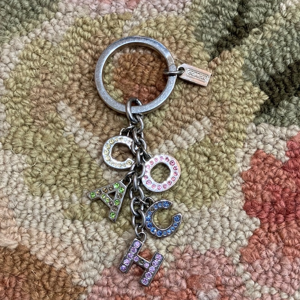 Coach sparkles rhinestones keychain. Missing rhinestones on A, C and H letters.